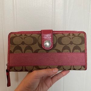 Pink and beige Coach wallet.